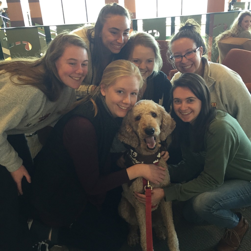 QU Students surround Louie with some love